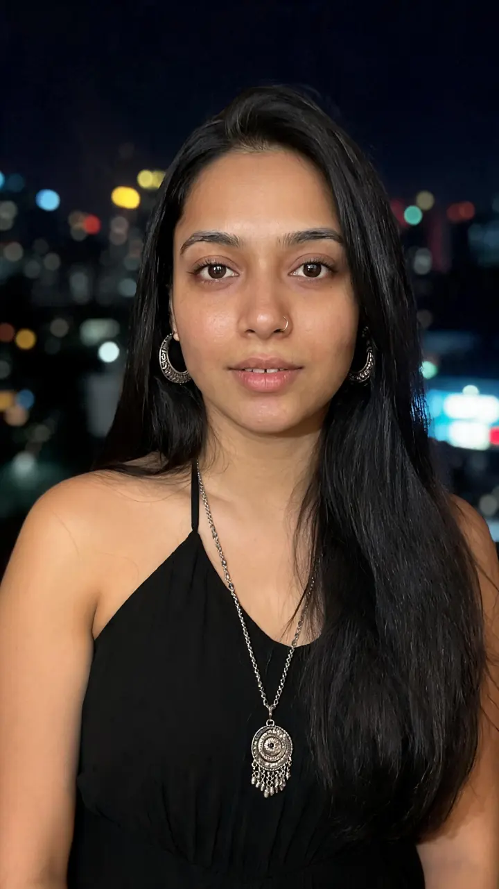 Tara in front of city lights at night